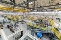 Sikorsky employees building CH-53K aircraft utilizing 3-D work instructions, new titanium machining centers with multi-floor ergonomic platforms.