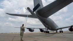 Airman 1st Class Jacob Helzer, 100th Maintenance Squadron hydraulics maintenance journeyman, uses the Boom Cover Tool on a KC-135 Stratotanker aircraft at RAF Mildenhall, United Kingdom, July 22, 2022. The Boom Cover Tool, created by Helzer, is expected to save 40,000 man-hours and $1 million annually.