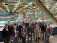 Members of NASA’s Advanced Composites Consortium, including representatives from NASA, the Federal Aviation Administration, Boeing, Spirit Aerosystems, Collins Aerospace, Northrop Grumman, and Electroimpact during a tour of Boeing’s facility in Everett, Washington.