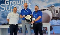 Ground Support Worldwide editor Josh Smith (at left) poses for a photo with John Vollbrecht and Jose Valenzuela from Menzies TPA, winner of the first Ground Support Team of the Year award.